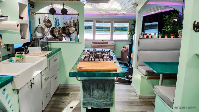 Slide: The Image of Interior of a renovated 1964 Kelly 62' yacht with modern kitchen. - 32