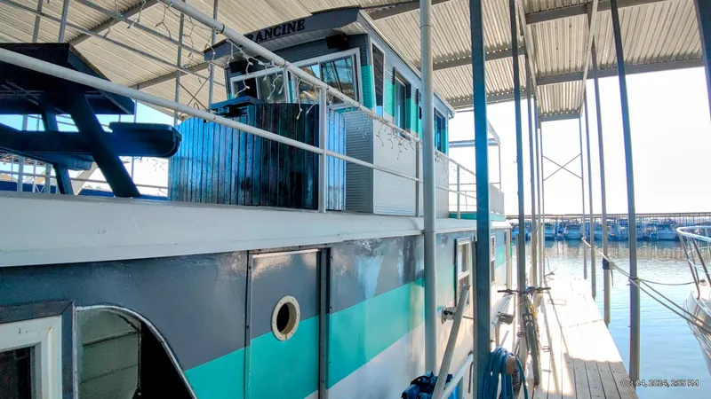Slide: The Image of 1964 Kelly 62' boat docked in harbor, side view. - 5