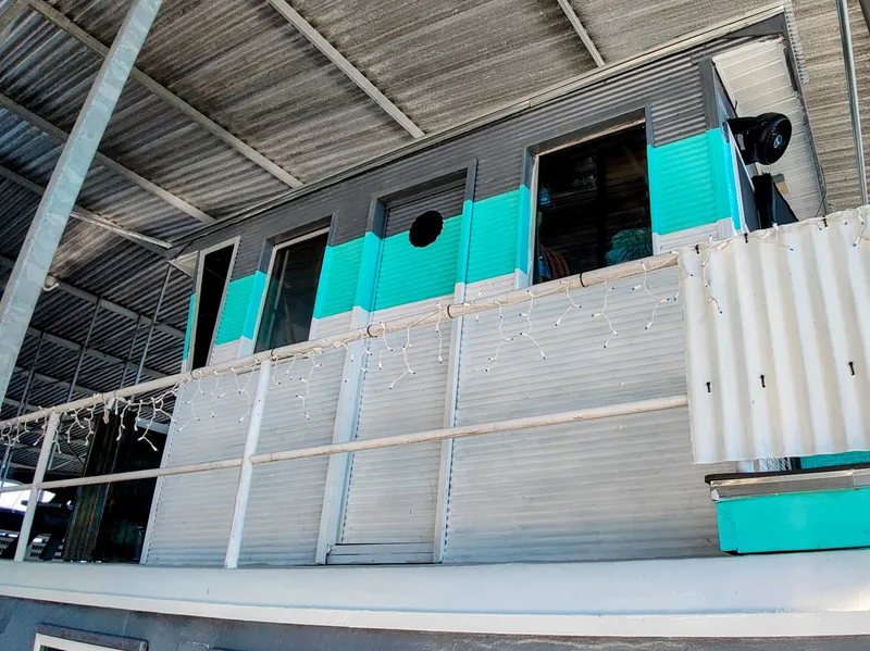 Slide: The Image of Retro houseboat Kelly 62' from 1964 with blue paneling. - 7