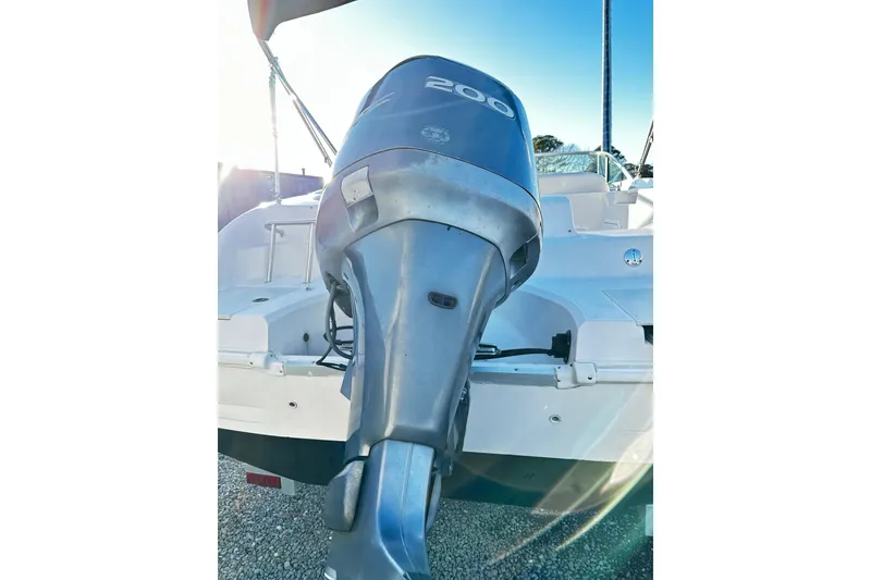 Slide: The Image of 2002 Godfrey Hurricane 237 boat with powerful 200 HP outboard motor. - 14