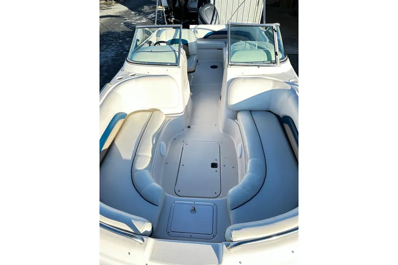 Slide: The Image of 2002 Godfrey Hurricane 237 boat interior with spacious seating and dual windshields. - 6