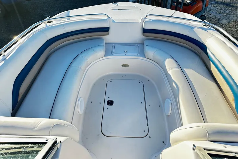 Slide: The Image of 2002 Godfrey Hurricane 237 boat interior with white and blue seating. - 7