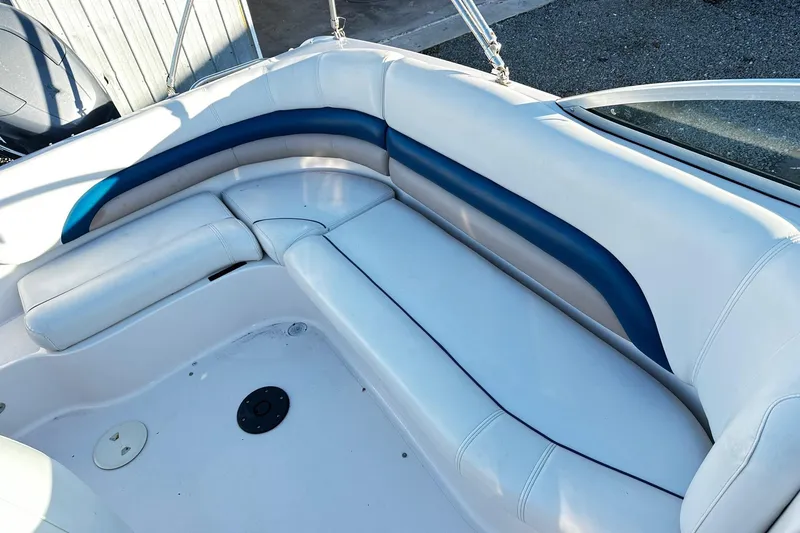 Slide: The Image of 2002 Godfrey Hurricane 237 boat interior with white and blue seating. - 8