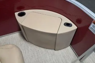 Slide: The Image of 2022 Bennington 21 SFXDI boat interior with beige seating and cup holders. - 10