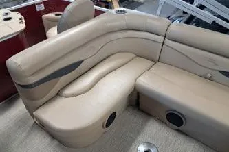 Slide: The Image of 2022 Bennington 21 SFXDI boat interior with beige seating and cup holders. - 3