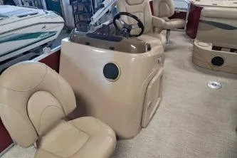 Slide: The Image of 2022 Bennington 21 SFXDI boat interior with beige seating and steering console. - 7