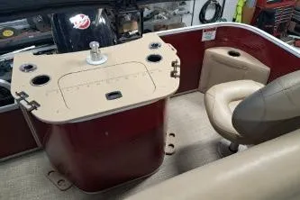 Slide: The Image of 2022 Bennington 21 SFXDI boat interior with seating and control panel. - 8