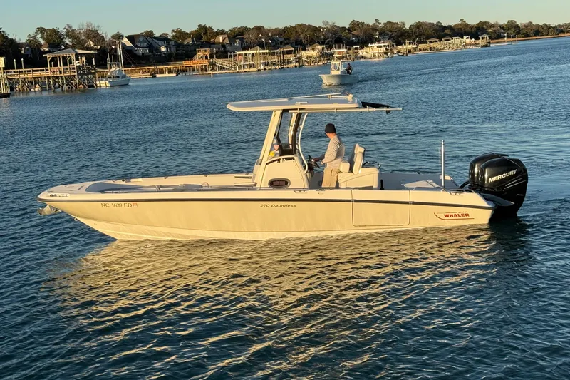 Slide: The Image of 2016 Boston Whaler 270 Dauntless boat on calm water, side view. - 1