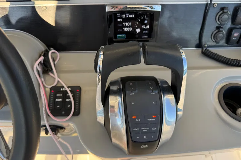 Slide: The Image of Control panel of a 2016 Boston Whaler 270 Dauntless boat with throttle and display. - 19