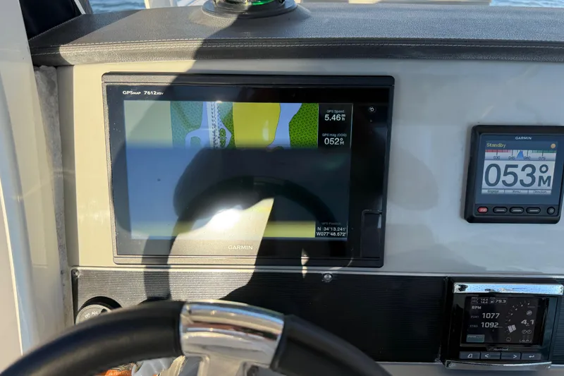 Slide: The Image of Dashboard of a 2016 Boston Whaler 270 Dauntless with Garmin navigation displays. - 20