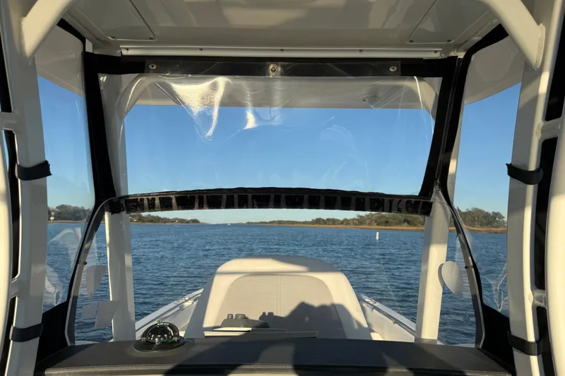 Slide: The Image of Interior view from a 2016 Boston Whaler 270 Dauntless boat on a calm lake. - 21