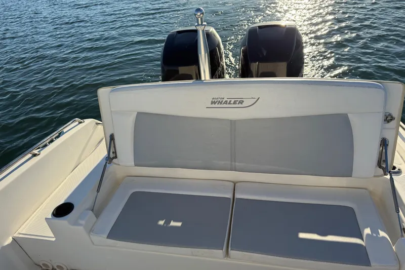 Slide: The Image of 2016 Boston Whaler 270 Dauntless boat with dual engines on calm water. - 24