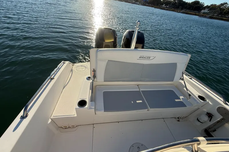 Slide: The Image of 2016 Boston Whaler 270 Dauntless boat with dual engines on calm water. - 25