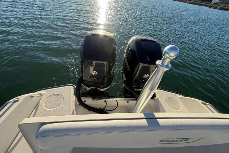 Slide: The Image of 2016 Boston Whaler 270 Dauntless boat with dual Mercury outboard engines on water. - 26