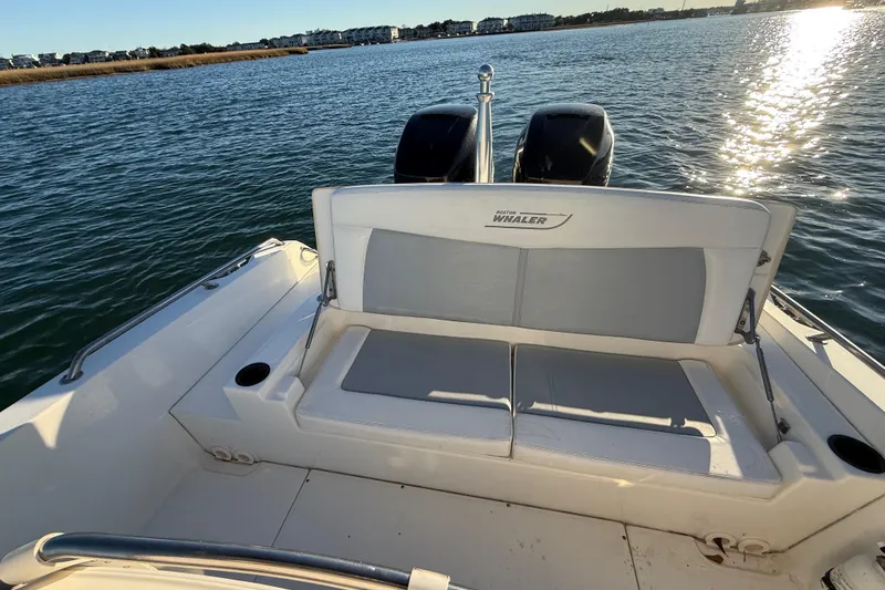 Slide: The Image of 2016 Boston Whaler 270 Dauntless boat with dual engines on a sunny day. - 34