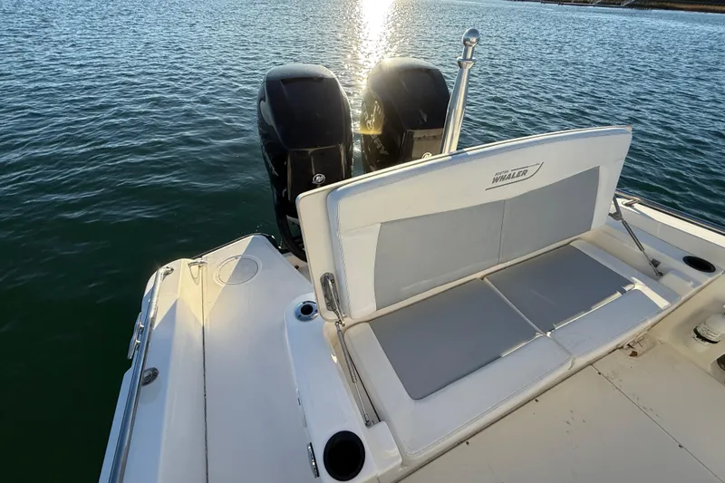 Slide: The Image of 2016 Boston Whaler 270 Dauntless boat with dual engines on calm water. - 39