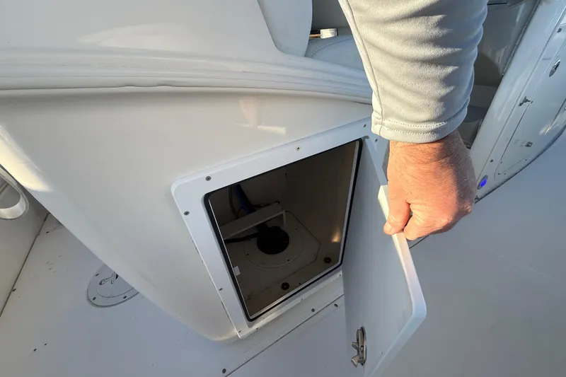 Slide: The Image of 2016 Boston Whaler 270 Dauntless storage compartment with open door. - 40