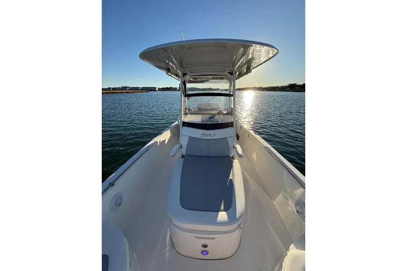 Slide: The Image of 2016 Boston Whaler 270 Dauntless boat on calm water at sunset. - 44
