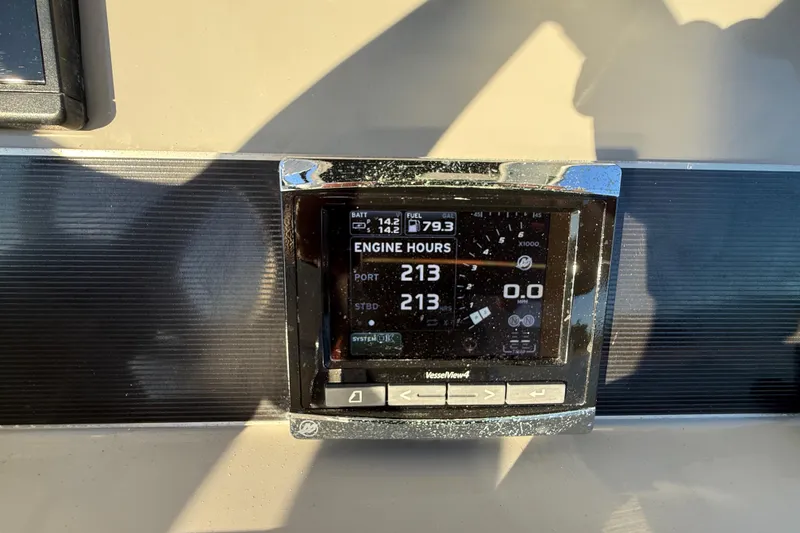 Slide: The Image of Display screen on 2016 Boston Whaler 270 Dauntless showing engine hours and fuel data. - 52