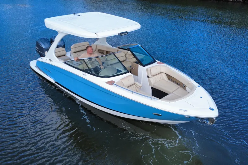 Slide: The Image of 2018 Regal 29 OBX boat cruising on calm blue water. - 1