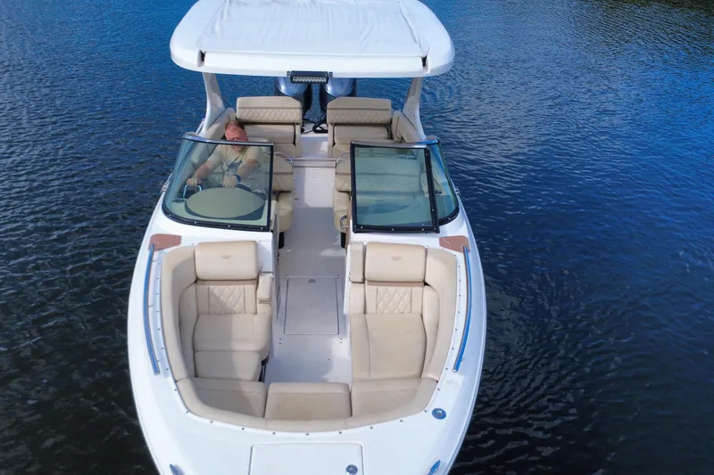 Slide: The Image of 2018 Regal 29 OBX boat on water, featuring spacious seating and sleek design. - 15
