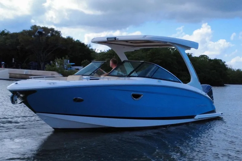 Slide: The Image of 2018 Regal 29 OBX boat on calm water. - 3