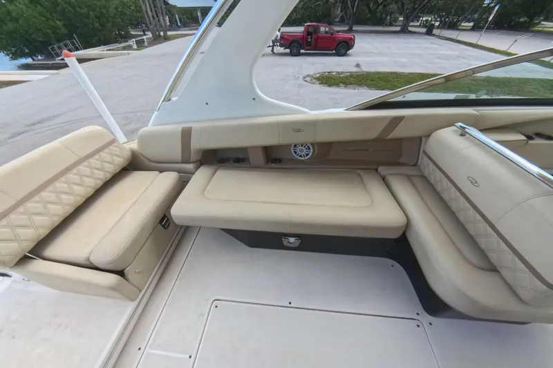 Slide: The Image of 2018 Regal 29 OBX boat interior with beige seating and sleek design. - 37