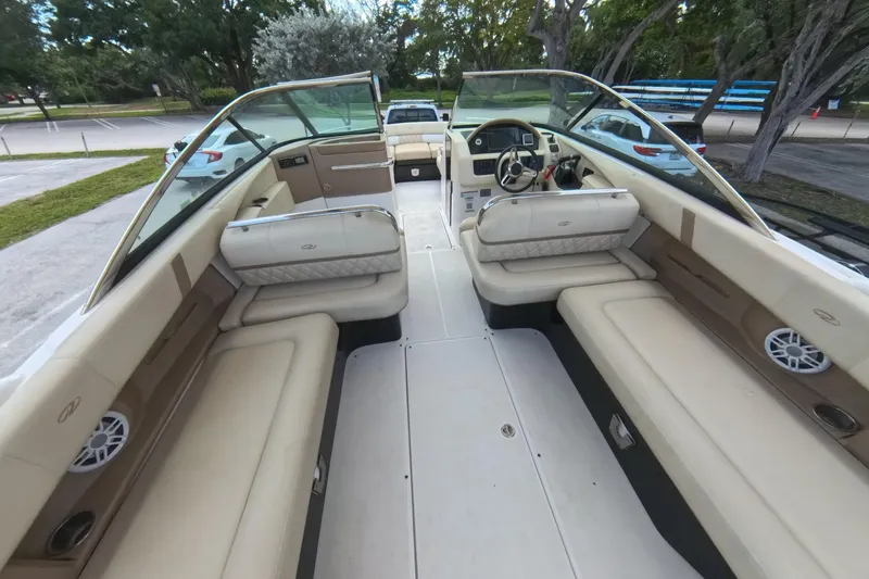 Slide: The Image of 2018 Regal 29 OBX boat interior with beige seating and modern dashboard. - 38