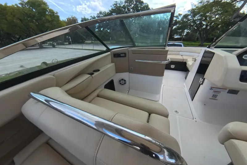 Slide: The Image of 2018 Regal 29 OBX boat interior with beige seating and sleek design. - 46