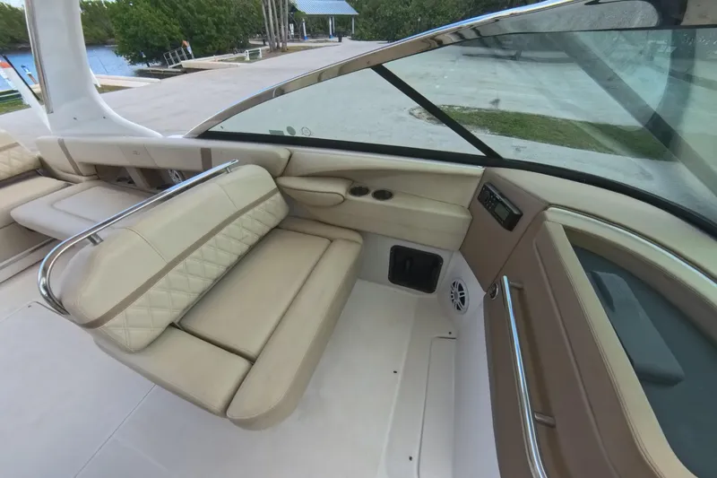 Slide: The Image of 2018 Regal 29 OBX boat interior with beige seating and modern dashboard. - 47