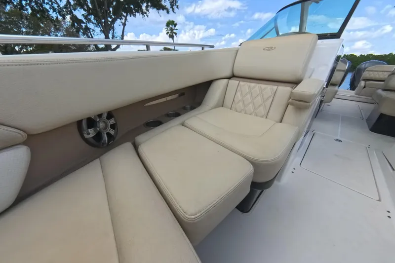Slide: The Image of 2018 Regal 29 OBX boat interior with beige seating and cup holders. - 52