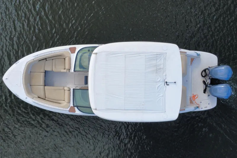 Slide: The Image of Top view of 2018 Regal 29 OBX boat with dual engines on water. - 53