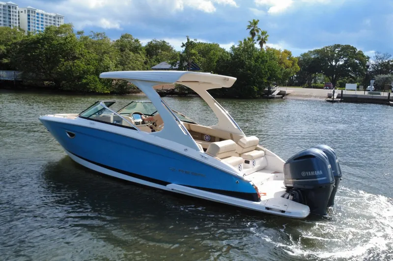 Slide: The Image of 2018 Regal 29 OBX boat with Yamaha engine on a scenic waterway. - 7