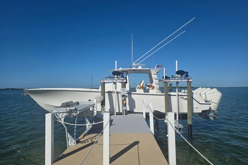 The Image of 2024 SeaVee 420Z boat docked on a sunny day, showcasing sleek design and powerful engines. - 1