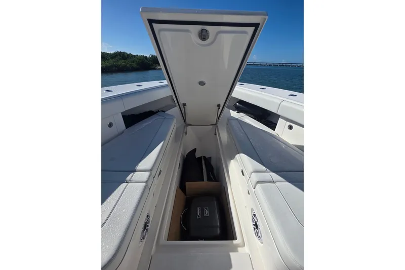 Slide: The Image of 2024 SeaVee 420Z boat storage compartment open, showcasing spacious interior design. - 11