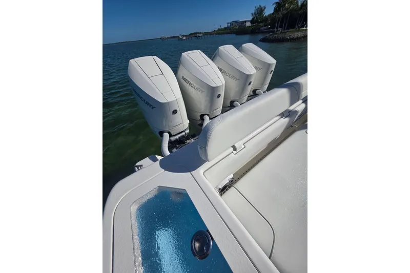 Slide: The Image of 2024 SeaVee 420Z boat with four Mercury outboard engines on a sunny day. - 12