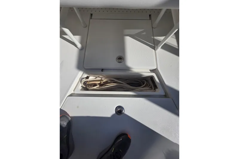 Slide: The Image of 2024 SeaVee 420Z boat deck with storage compartment and rope. - 6