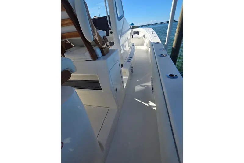 Slide: The Image of 2024 SeaVee 420Z boat interior, showcasing sleek design and spacious walkway. - 8