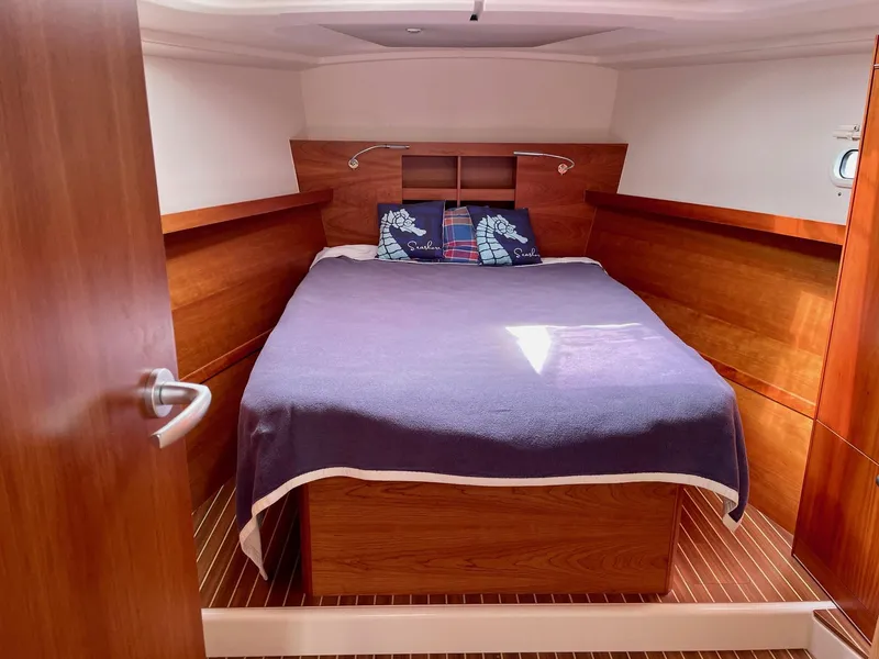 Slide: The Image of Interior of a 2016 Hanse 455 yacht with cozy bed. - 10