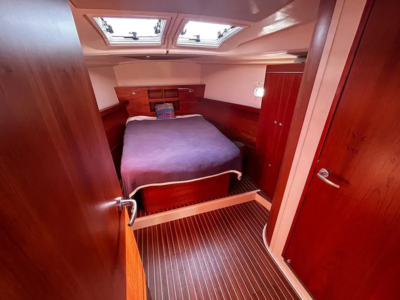 Slide: The Image of Interior of a 2016 Hanse 455 yacht featuring a cozy bedroom. - 17