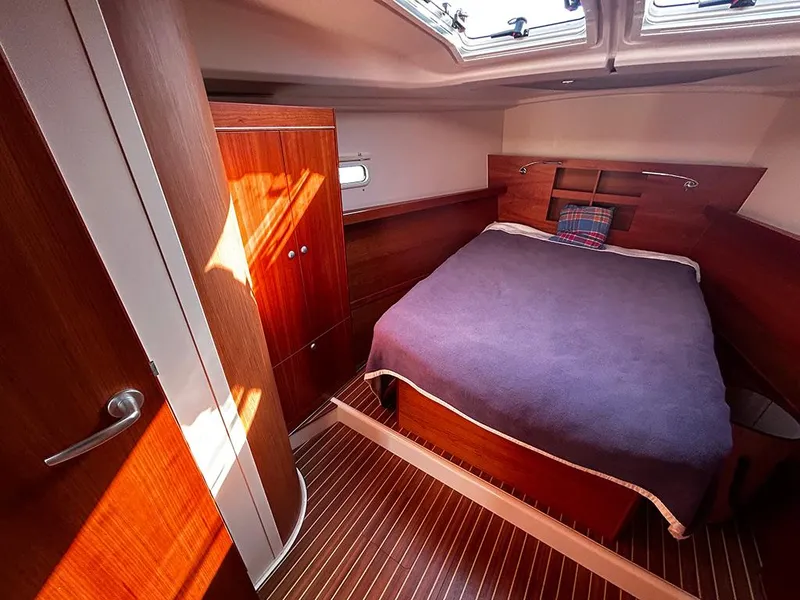Slide: The Image of Interior of a 2016 Hanse 455 yacht featuring a cozy bedroom. - 18