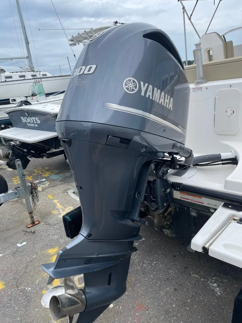 Slide: The Image of Yamaha 300 outboard motor on a 2016 Pursuit DC 235 Dual Console boat. - 18