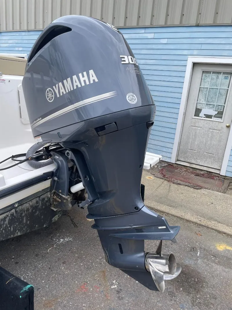Slide: The Image of Yamaha 300 outboard motor on a 2016 Pursuit DC 235 Dual Console boat. - 19