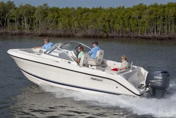Slide: The Image of Manufacturer Provided Image: 2016 Pursuit DC 235 Dual Console boat cruising on water with passengers. - 27