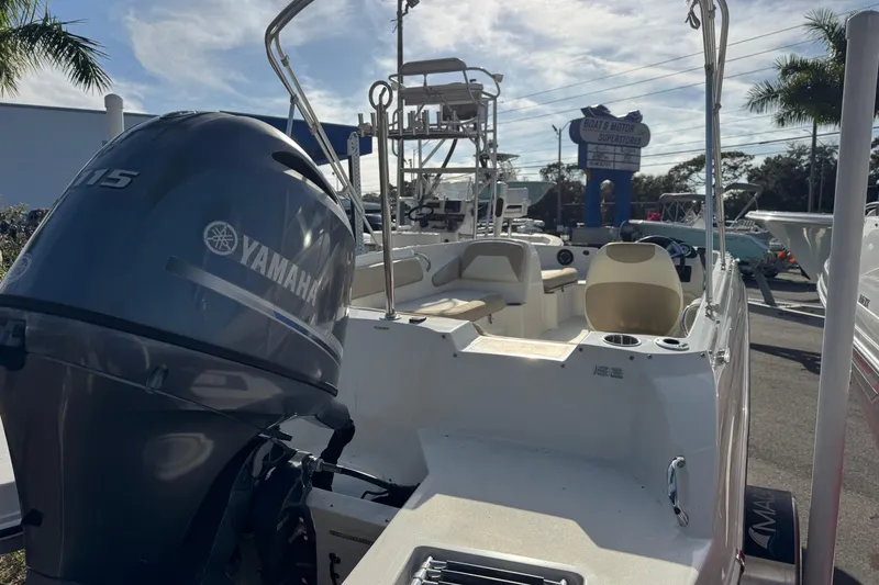 Slide: The Image of 2016 Stingray 182 SC boat with Yamaha 115 outboard motor in a dealership lot. - 5
