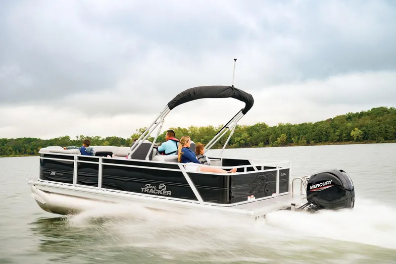 Slide: The Image of 2026 Sun Tracker Party Barge 22 RF DLX pontoon boat displayed indoors. - 2