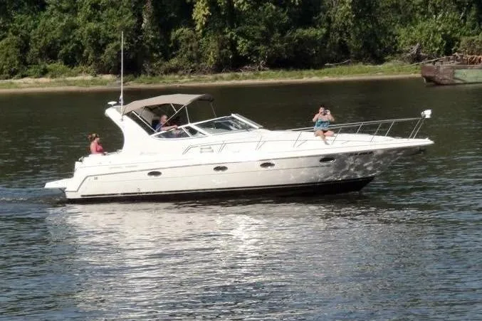 The Image of 2004 Cruisers Yachts 3372 Express on a calm river - 0