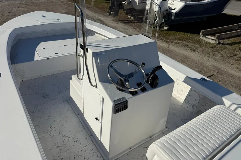 Slide: The Image of 2026 C-Hawk 25 Center Console boat in a marina, showcasing spacious deck and console. - 10