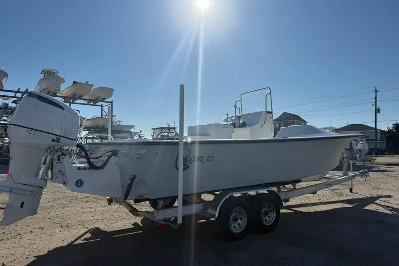 Slide: The Image of 2026 C-Hawk 25 Center Console boat interior with storage compartment. - 6