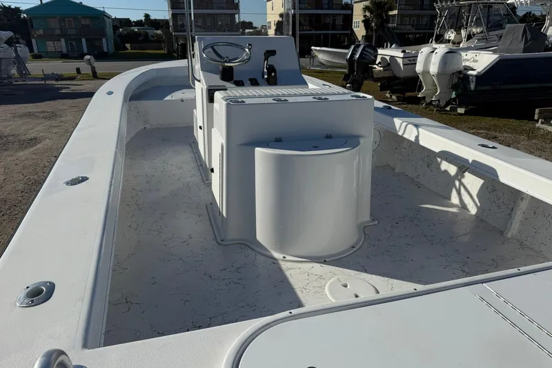 Slide: The Image of 2026 C-Hawk 25 Center Console boat on trailer, displayed outdoors. - 8